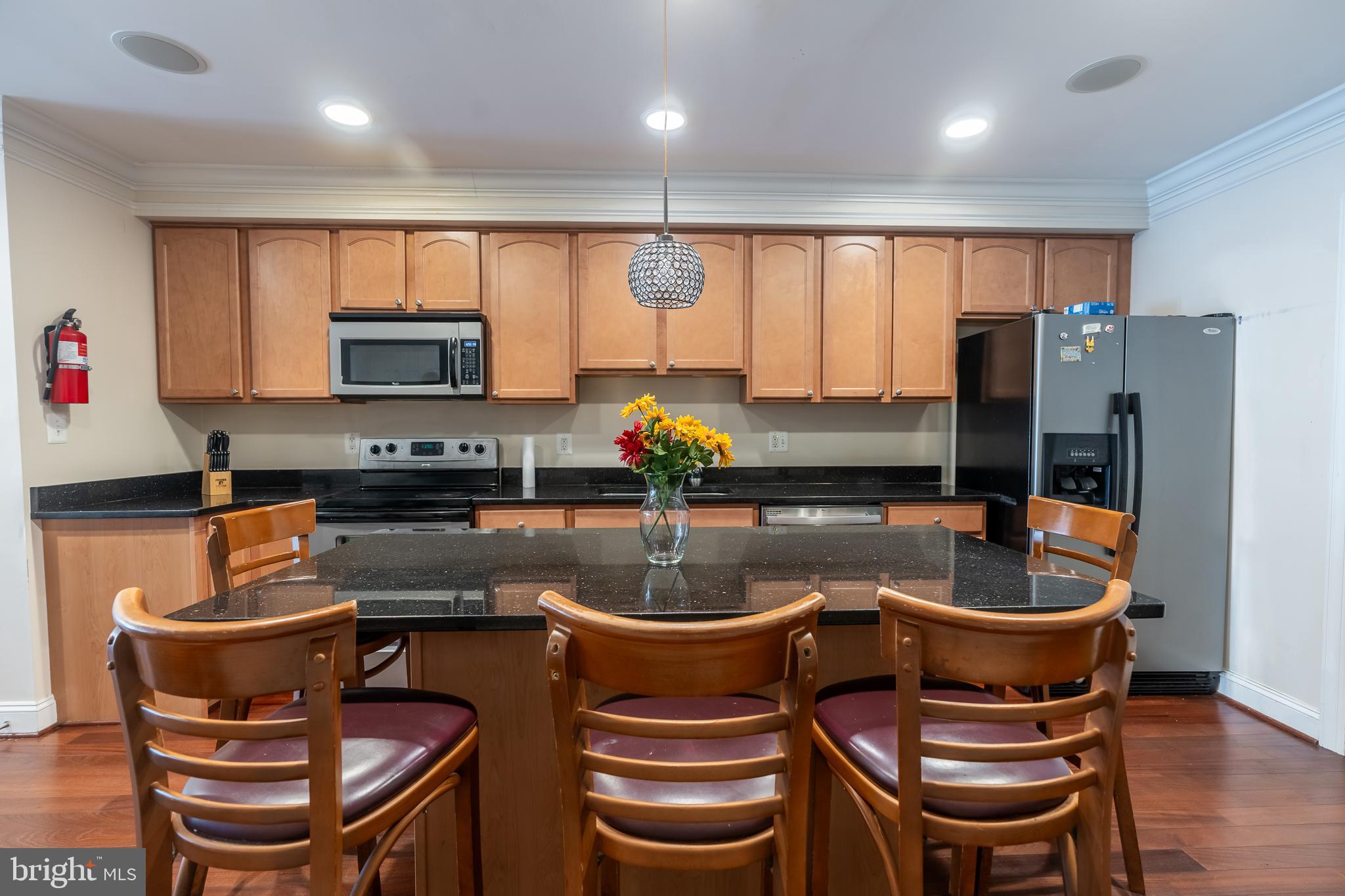 106 West Cross Street Baltimore, MD 21230 - Photo 6 of 41 a kitchen with a table and chairs