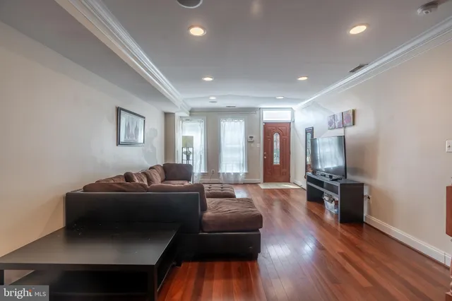 a room with furniture and a wooden floor