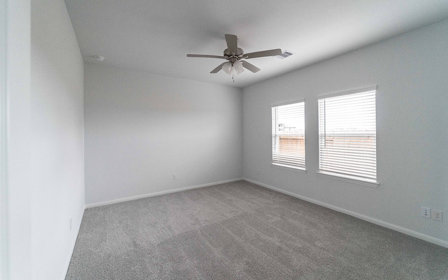 1718 Windrose Bend Angleton, TX 77515 - Photo 6 of 14 an empty room with a window and a fan