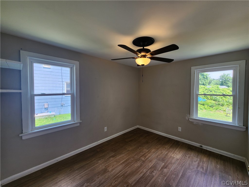 529 German School Road Richmond, VA 23225 - Photo 16 of 19 a view of an empty room with wooden floor and a window