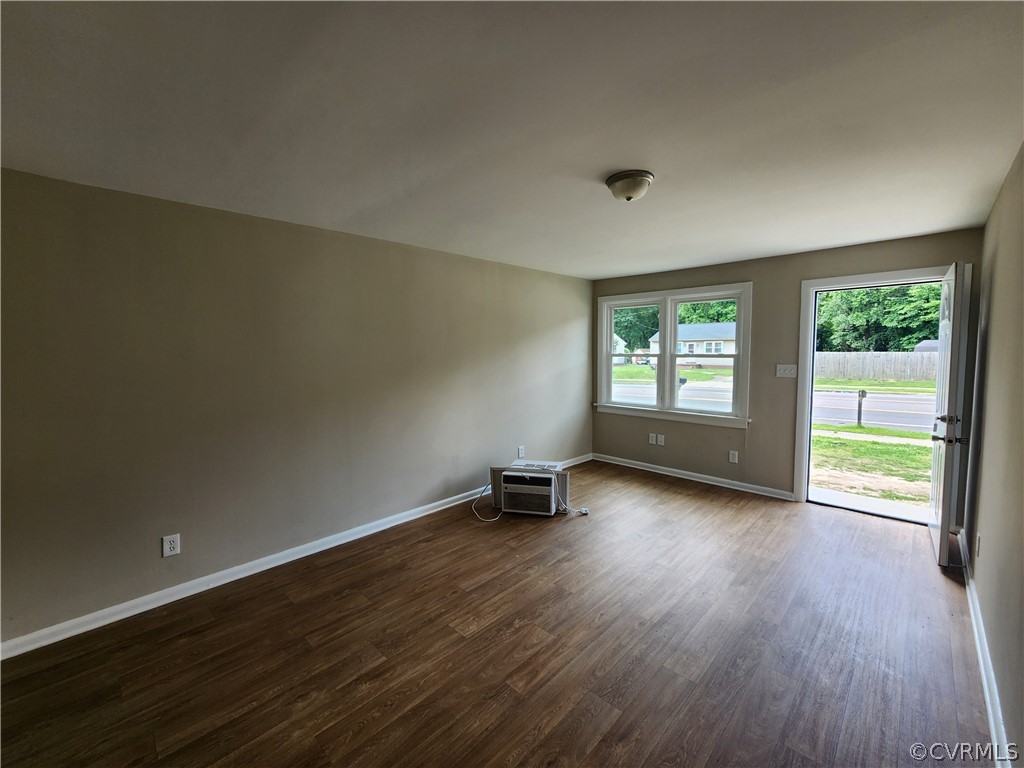 529 German School Road Richmond, VA 23225 - Photo 6 of 19 an empty room with wooden floor and windows