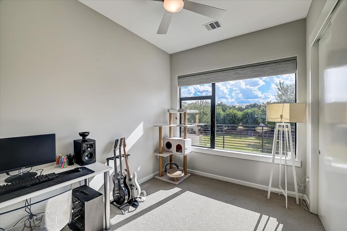 5921 Hiline Road, Unit 1204 Austin, TX 78734 - Photo 17 of 36 Carpeted home office featuring baseboards and ceiling fan