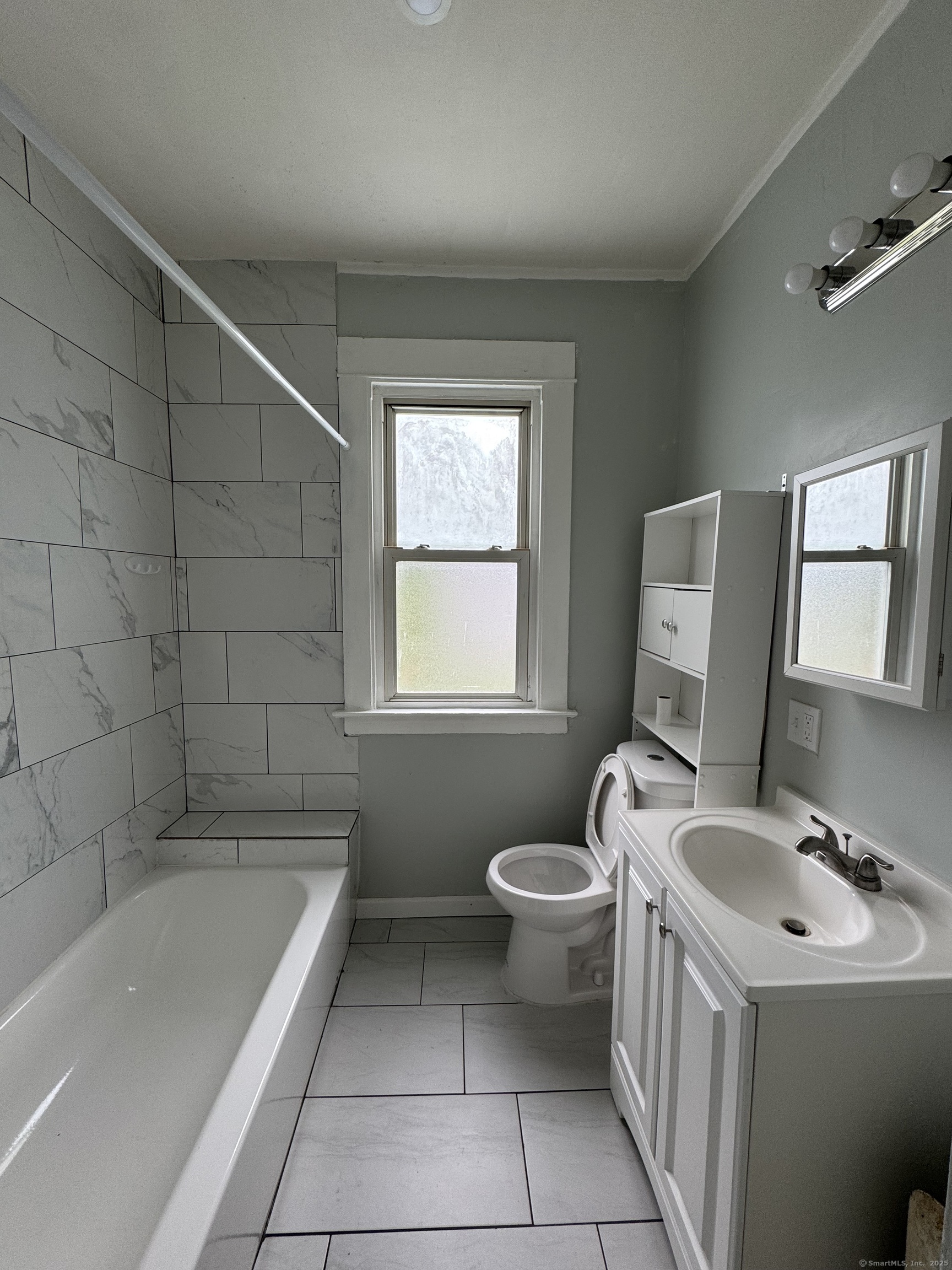916 Winchester Avenue, Unit 1 New Haven, CT 06511 - Photo 4 of 10 a bathroom with a sink toilet and bathtub