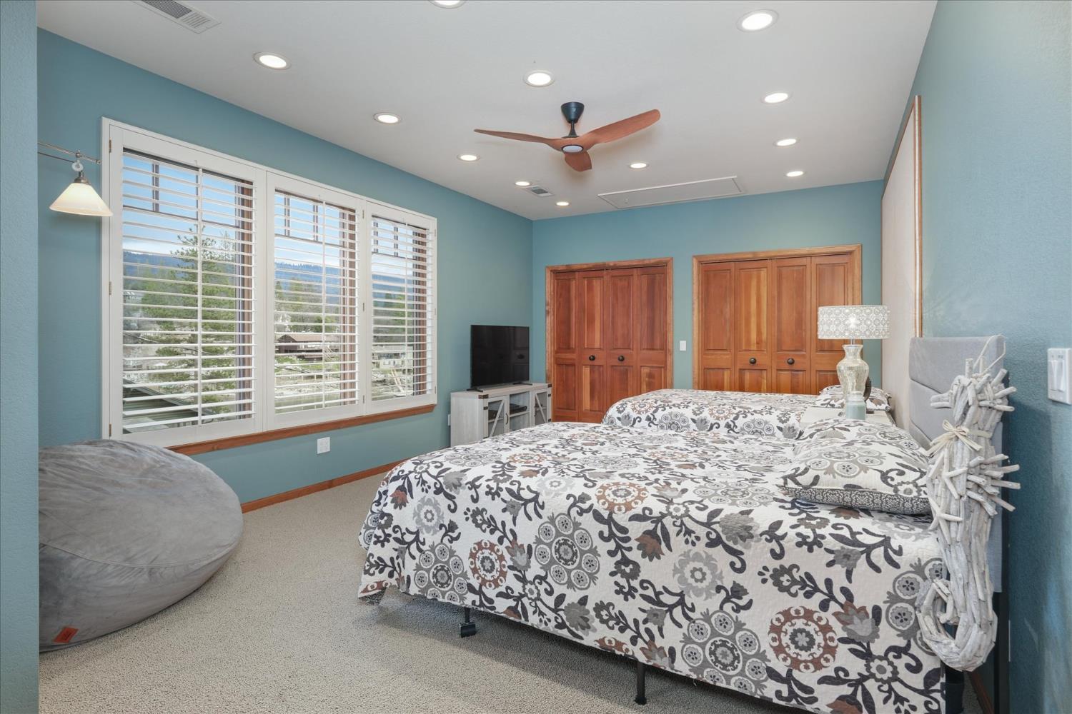 39290 Point Bass Lake, CA 93604 - Photo 21 of 80 a bed sitting in a spacious bedroom next to a window