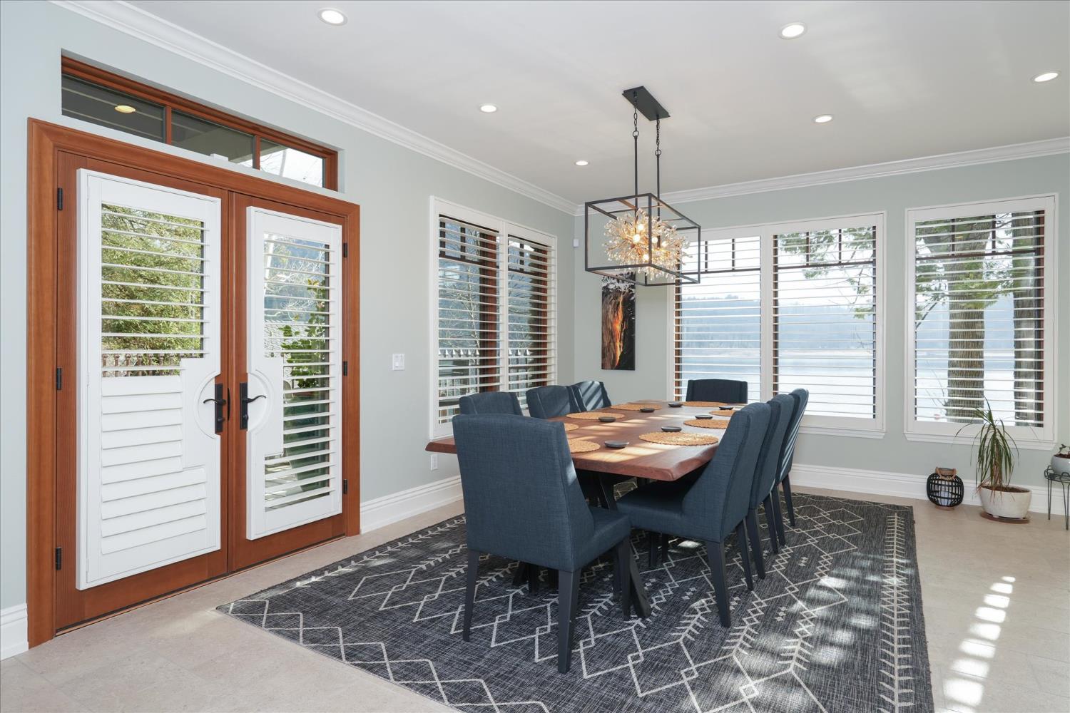 39290 Point Bass Lake, CA 93604 - Photo 52 of 80 a dining room with furniture a chandelier and wooden floor