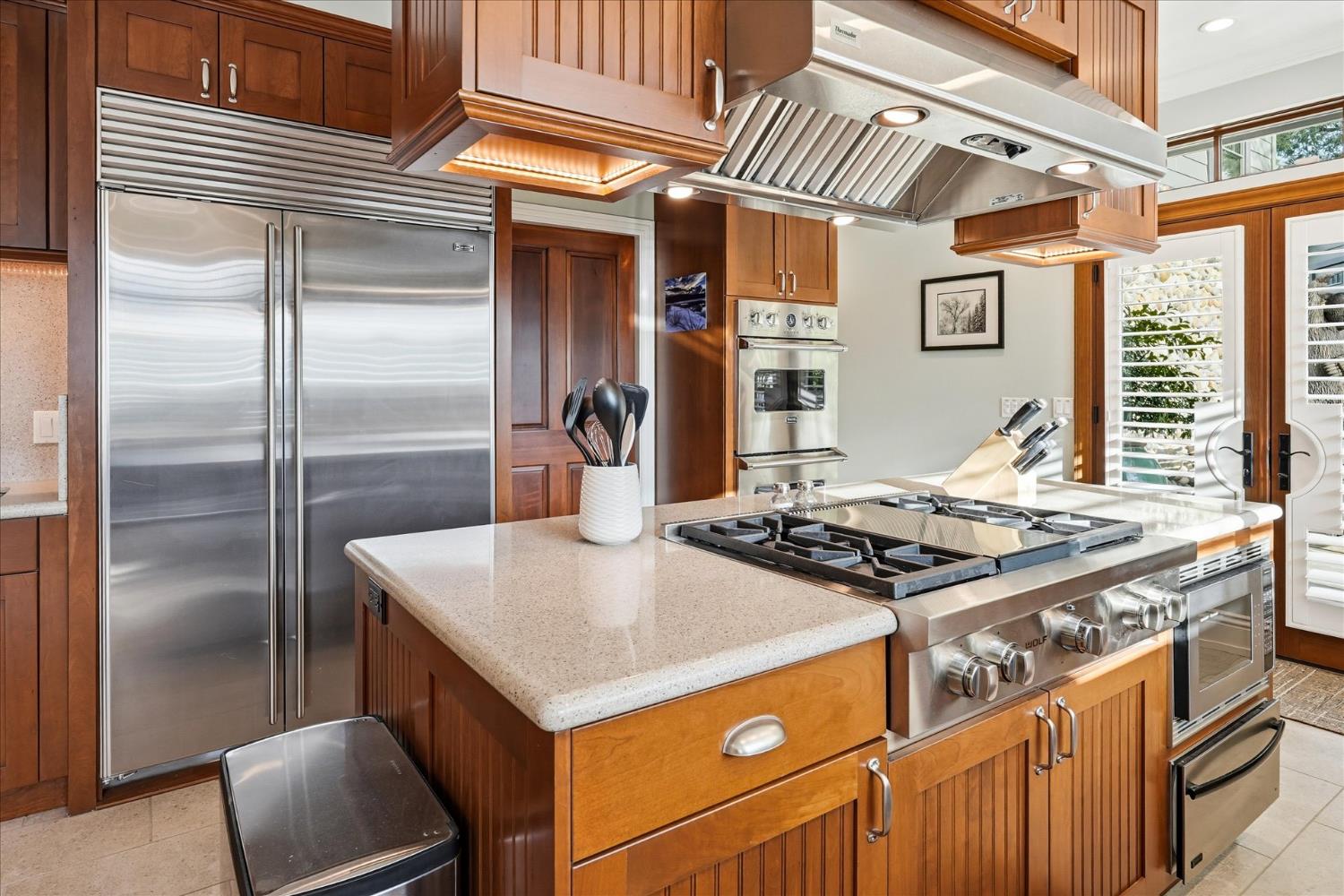39290 Point Bass Lake, CA 93604 - Photo 62 of 80 a kitchen with stainless steel appliances granite countertop a stove and a refrigerator