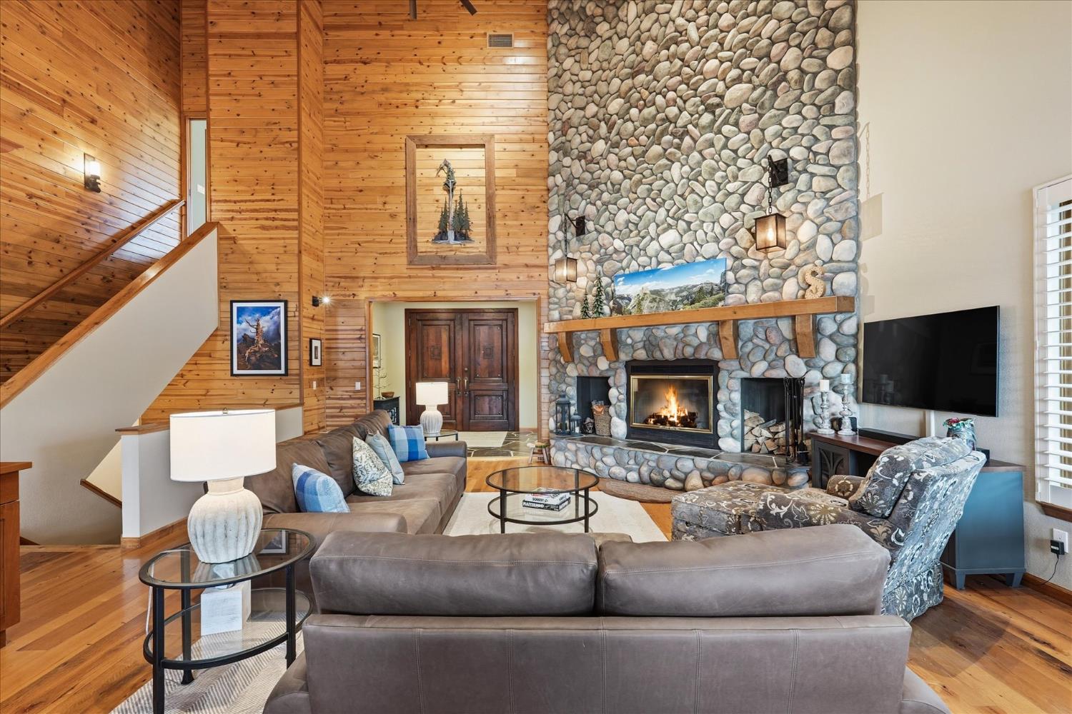 39290 Point Bass Lake, CA 93604 - Photo 9 of 80 a living room with furniture a flat screen tv and a fireplace