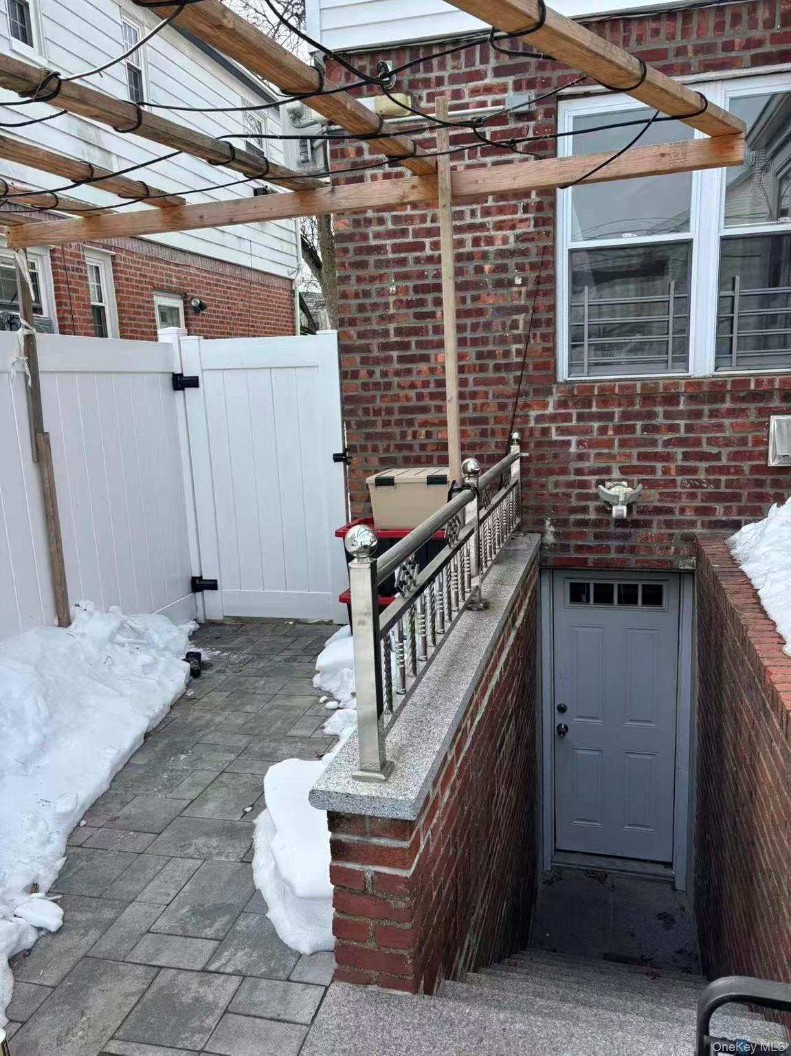 75-47 193rd Street Queens, NY 11366 - Photo 23 of 27 a view of a patio with table and chairs