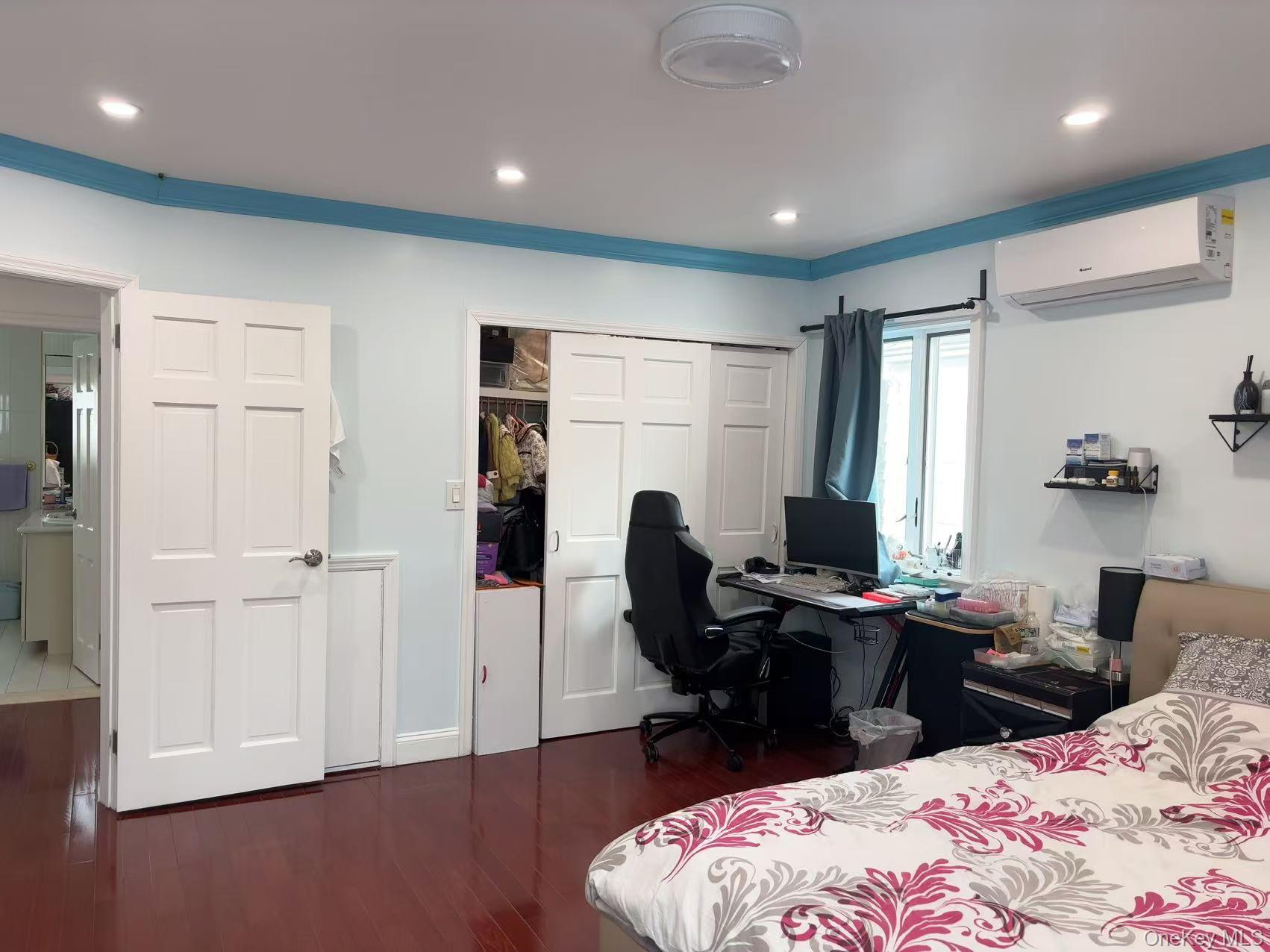 75-47 193rd Street Queens, NY 11366 - Photo 8 of 27 a bedroom with bed and a computer on desk