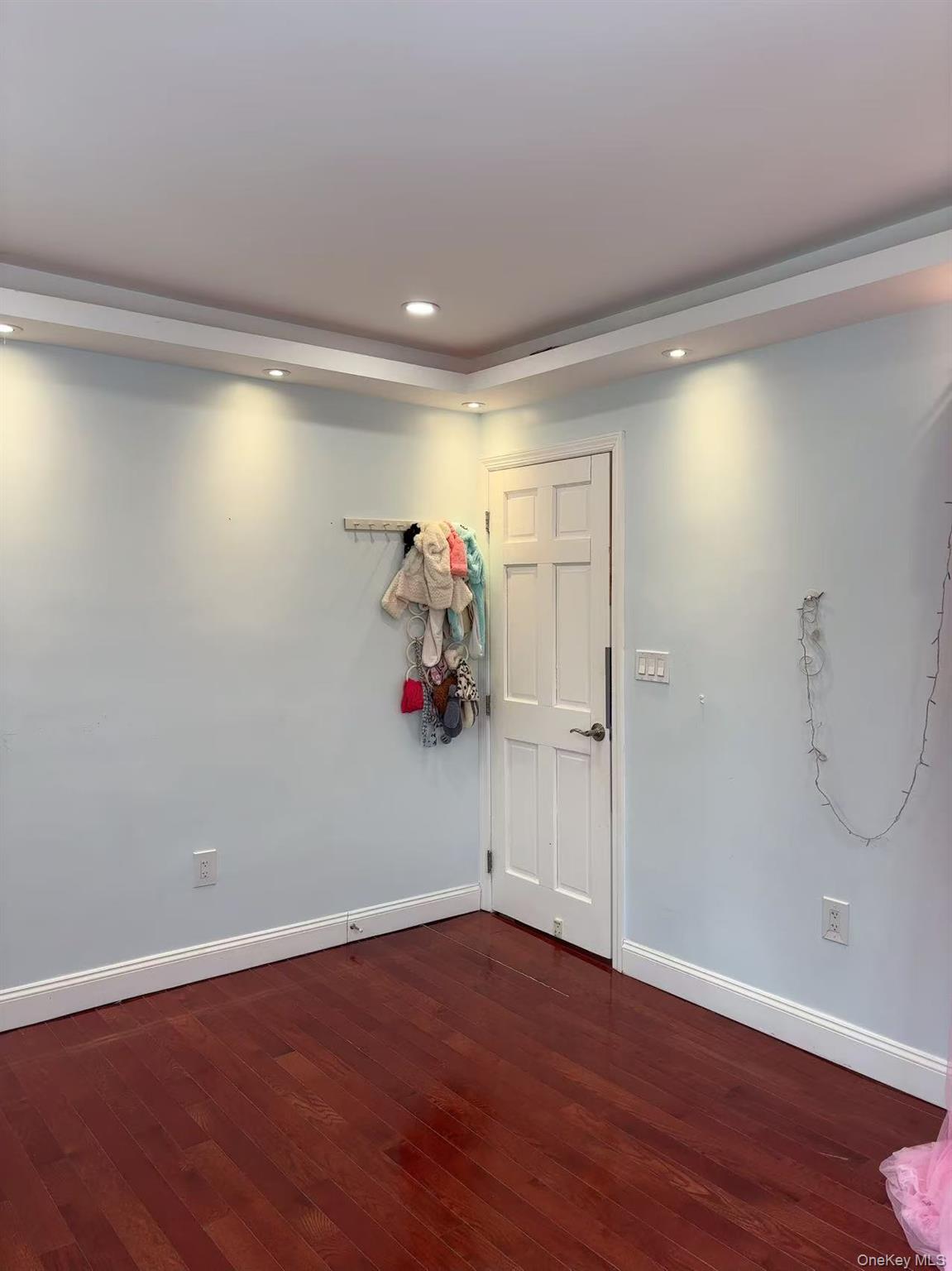 75-47 193rd Street Queens, NY 11366 - Photo 10 of 27 a view of empty room with wooden floor and fan