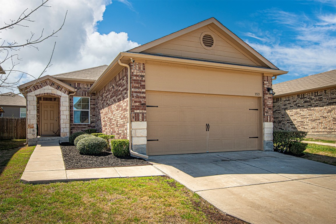 3513 Ortman Drive Pflugerville, TX 78660 - Photo 1 of 17 a front view of a house with garden