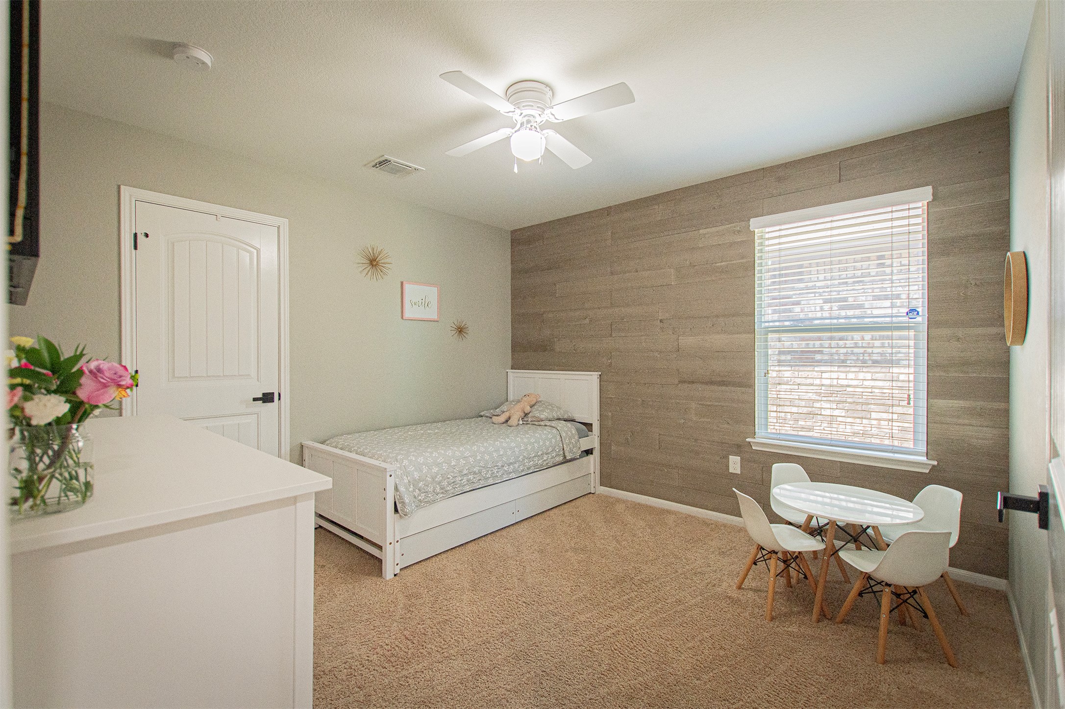 3513 Ortman Drive Pflugerville, TX 78660 - Photo 11 of 17 a bedroom with a bed and a table chair