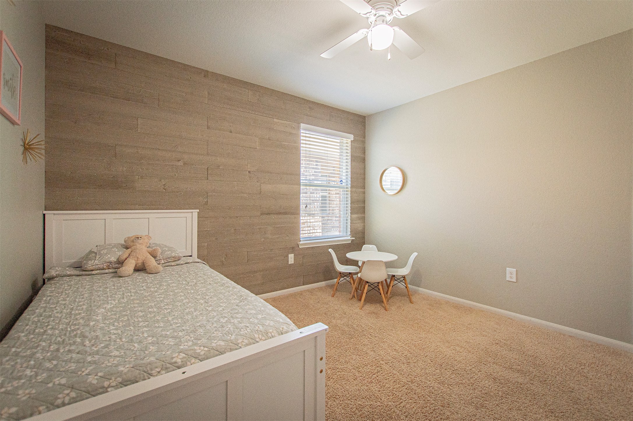 3513 Ortman Drive Pflugerville, TX 78660 - Photo 12 of 17 a bedroom with a large bed and a chair