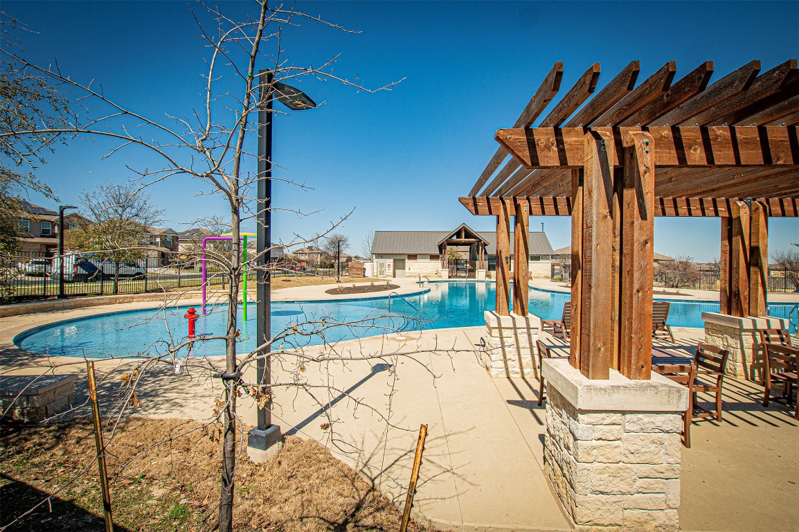 3513 Ortman Drive Pflugerville, TX 78660 - Photo 17 of 17 a view of swimming pool with lawn chairs