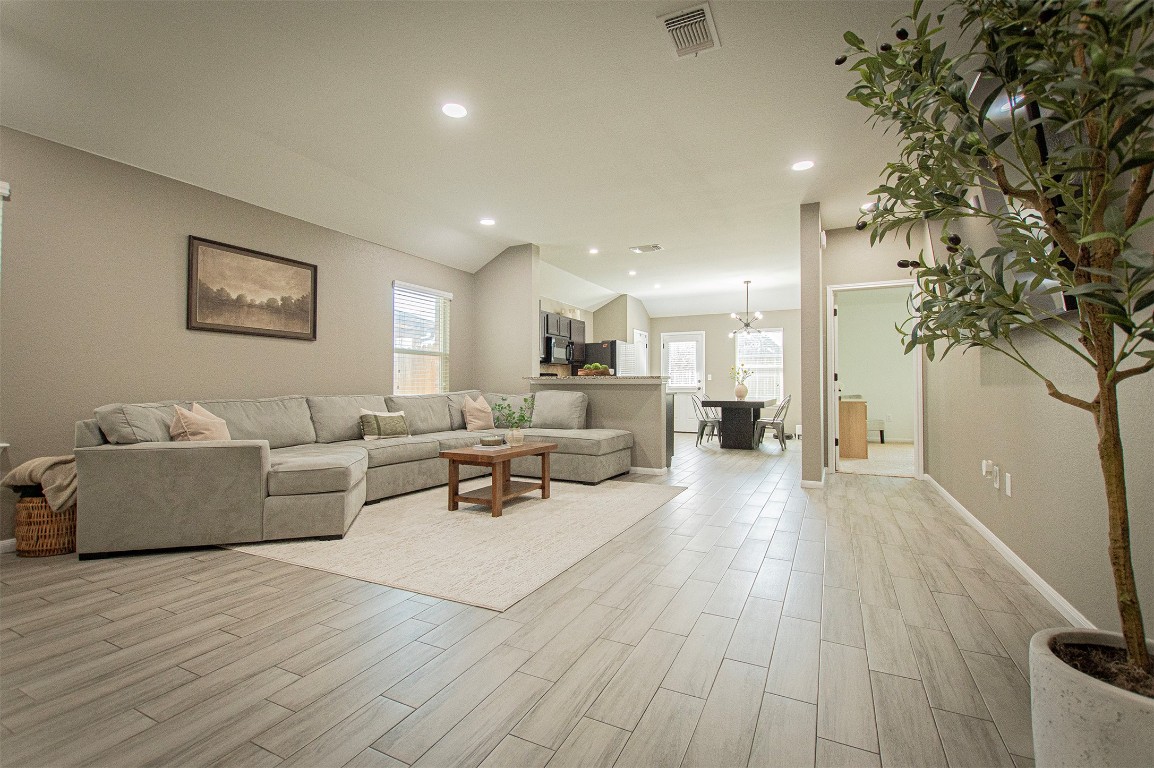 3513 Ortman Drive Pflugerville, TX 78660 - Photo 5 of 17 a living room with furniture and a wooden floor