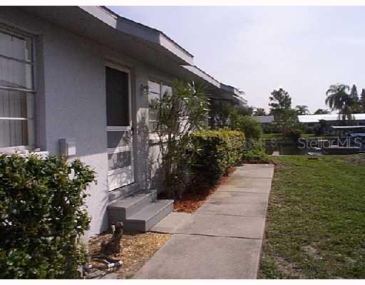 1045 Apollo Beach, Unit B Apollo Beach, FL 33572 - Photo 1 of 1 a backyard of a house with lots of green space