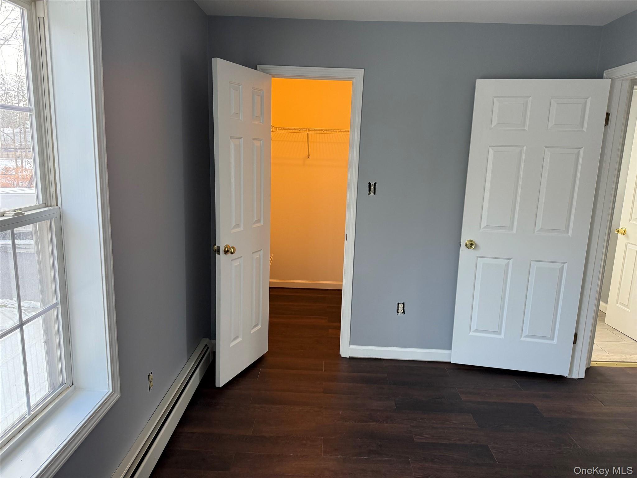 17 Orchard Place, Unit C Poughkeepsie, NY 12601 - Photo 13 of 20 a view of an empty room with wooden floor and a window
