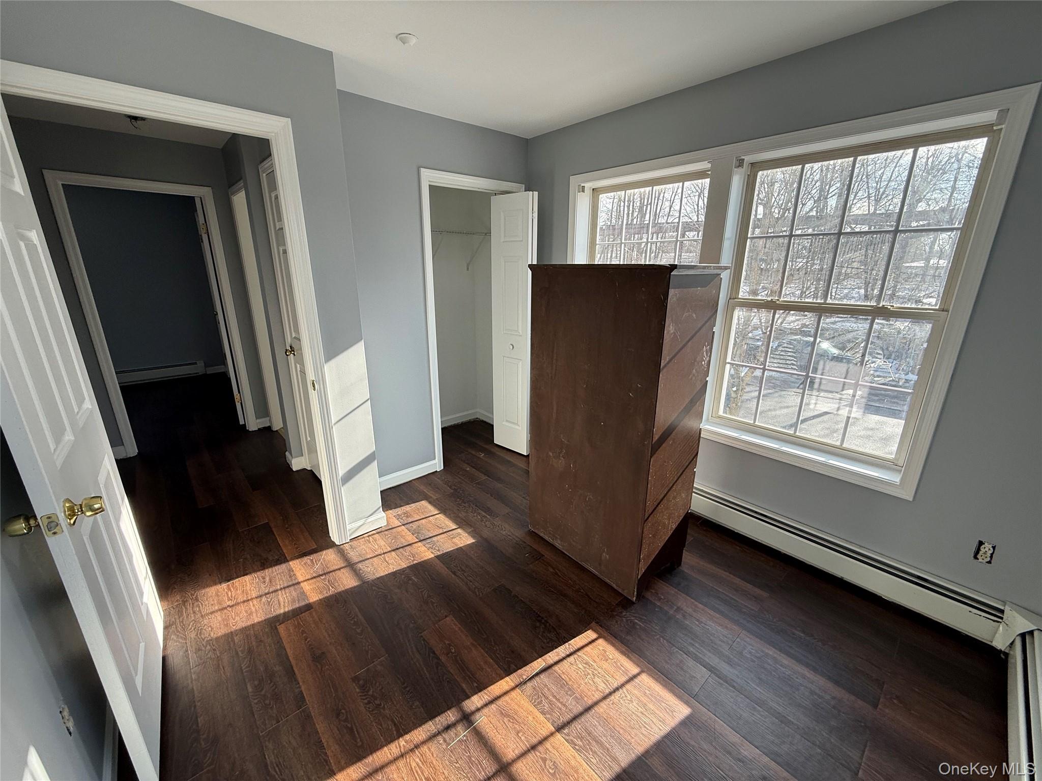 17 Orchard Place, Unit C Poughkeepsie, NY 12601 - Photo 17 of 20 a view of an empty room with wooden floor and a window