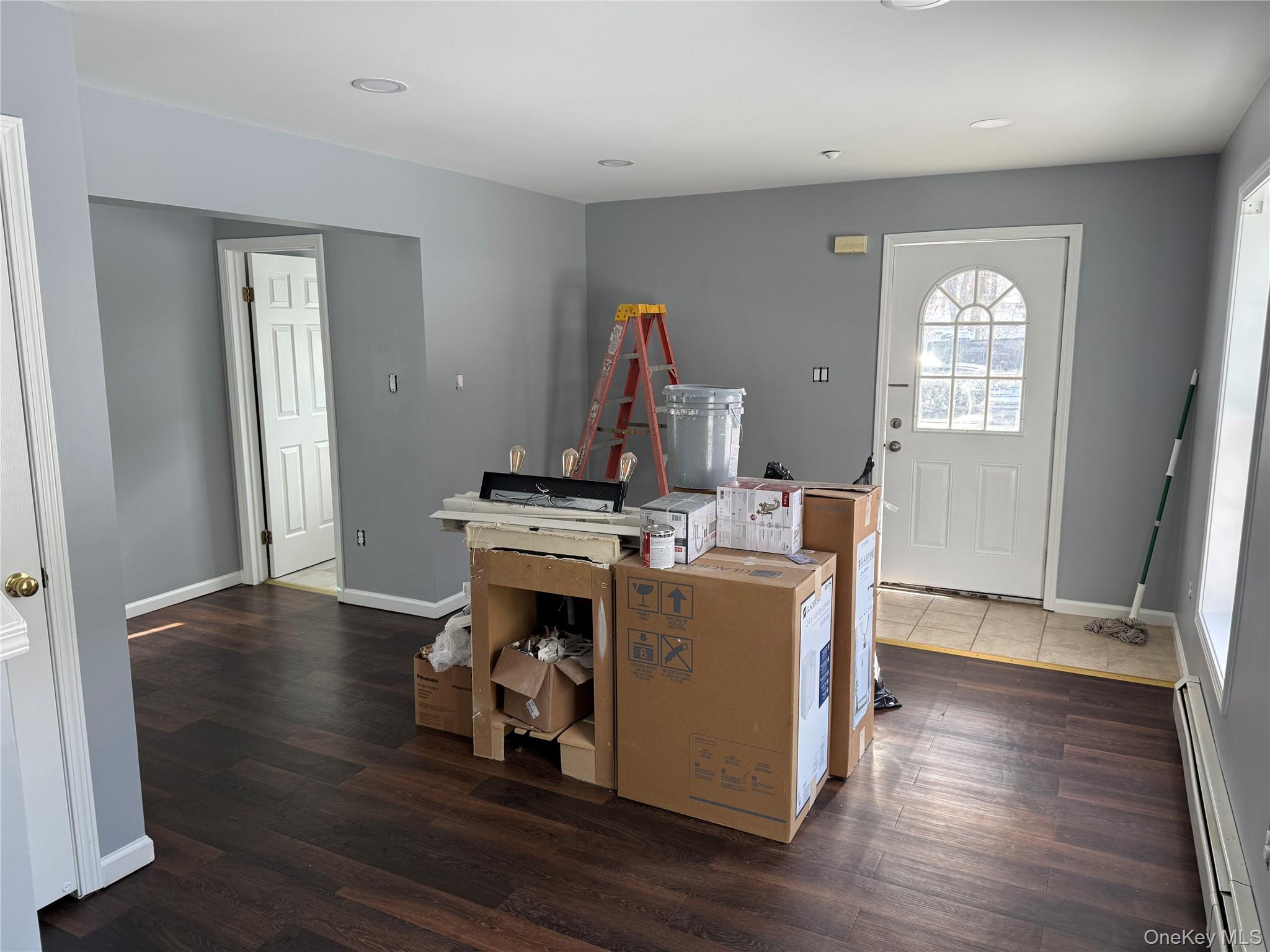 17 Orchard Place, Unit C Poughkeepsie, NY 12601 - Photo 3 of 20 a room with furniture wooden floor and window