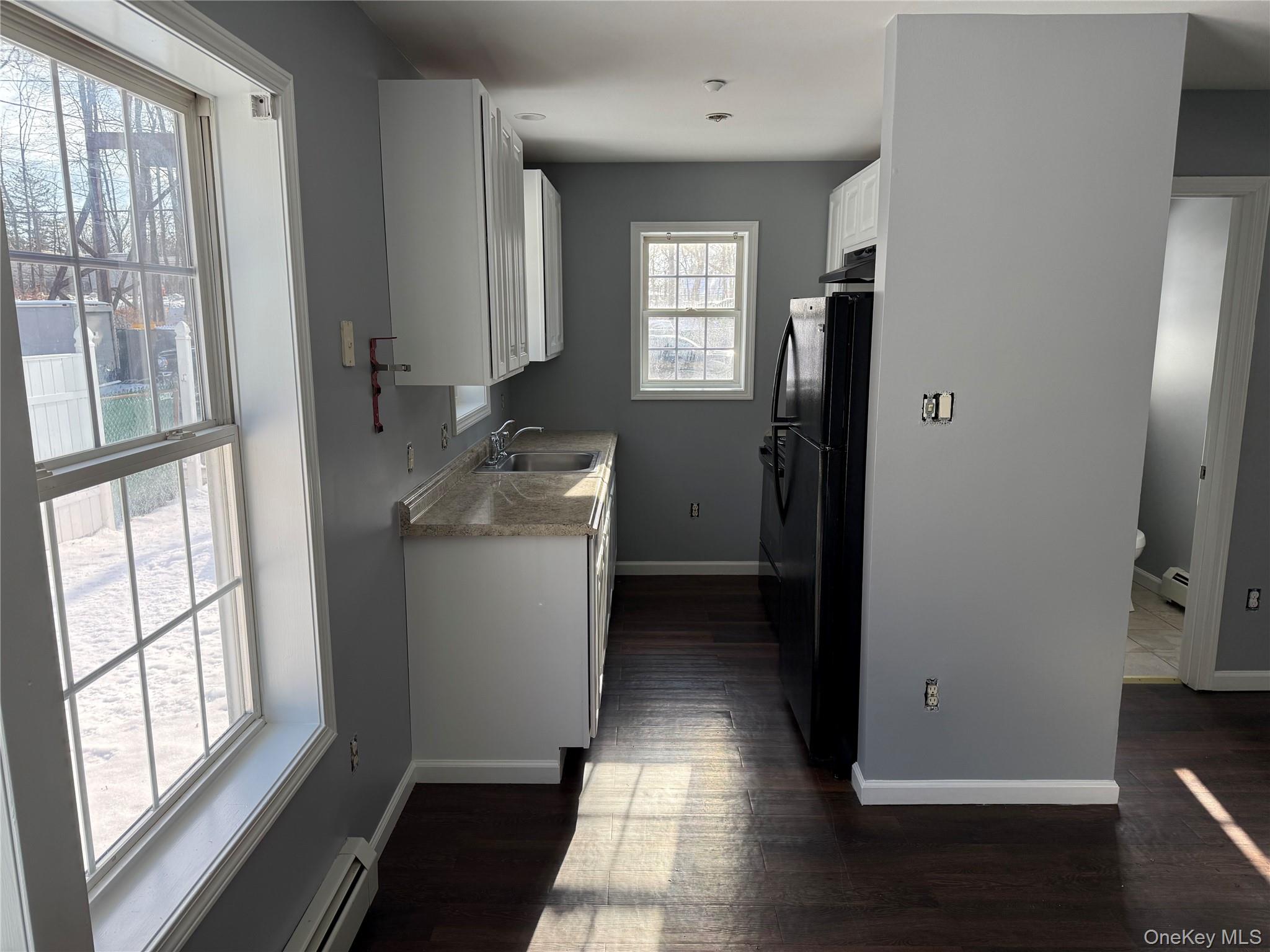 17 Orchard Place, Unit C Poughkeepsie, NY 12601 - Photo 5 of 20 a room with a window and wooden floor