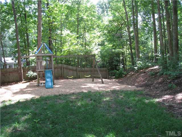 5709 Edgedale Drive Raleigh, NC 27612 - Photo 12 of 12 a view of a patio with a yard