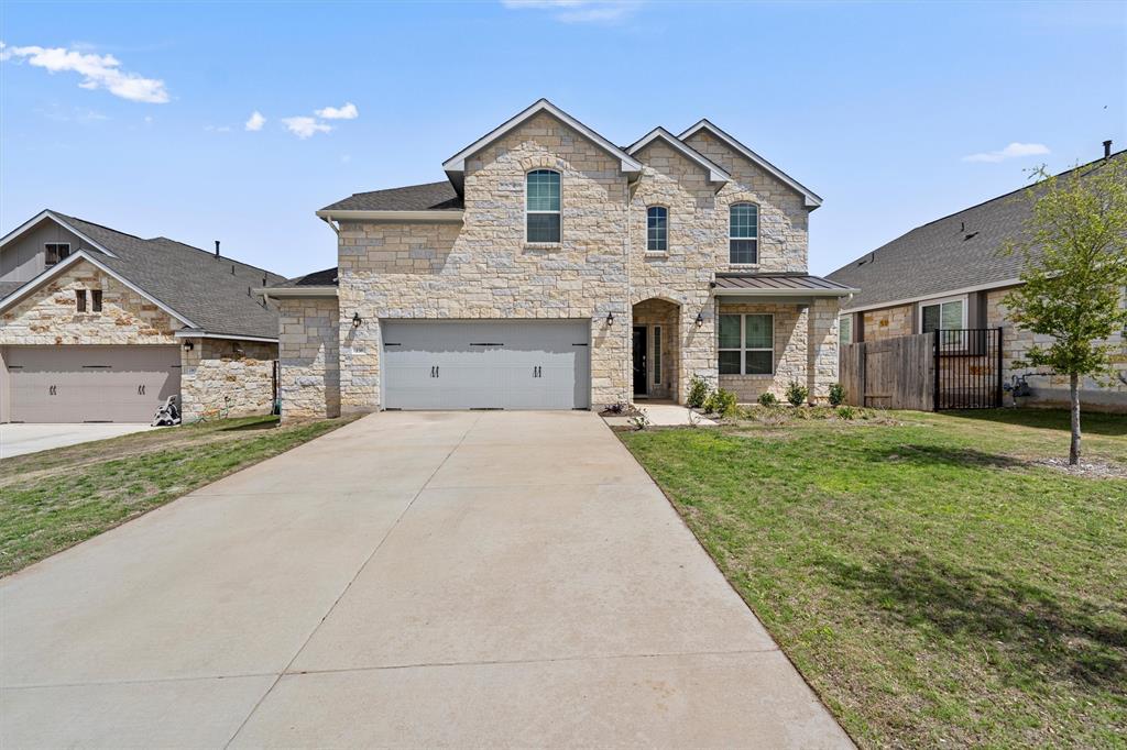 236 Prato Place Georgetown, TX 78628 - Photo 2 of 40 A spacious home with attractive stone construction and a welcoming front entrance.