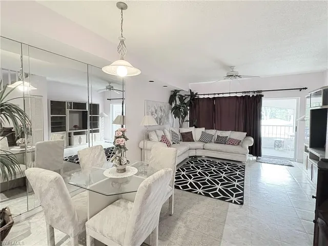 a view of a livingroom with furniture and window