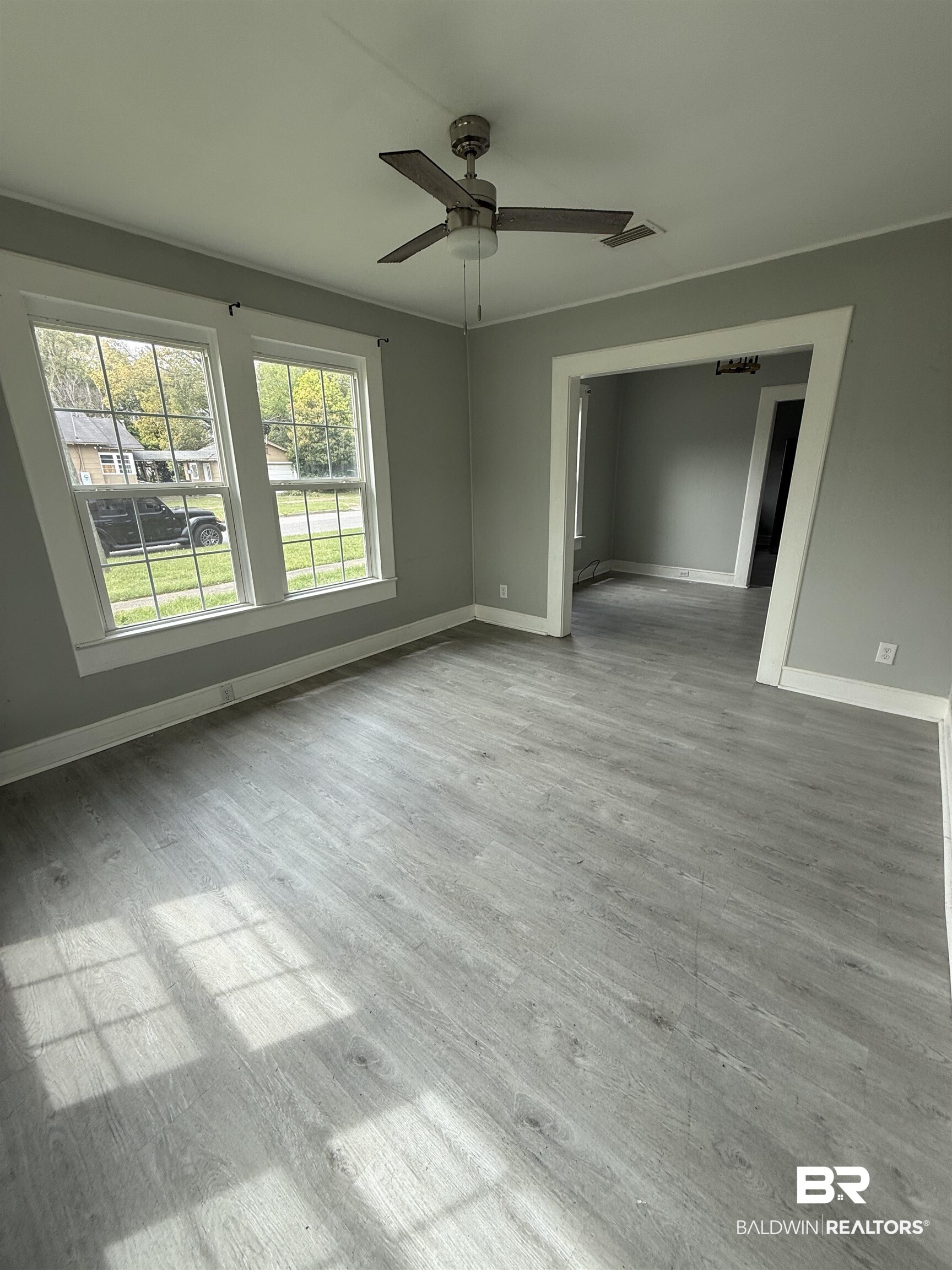 1848 Canal Street Mobile, AL 36606 - Photo 2 of 11 Spare room featuring ceiling fan and light wood-type flooring