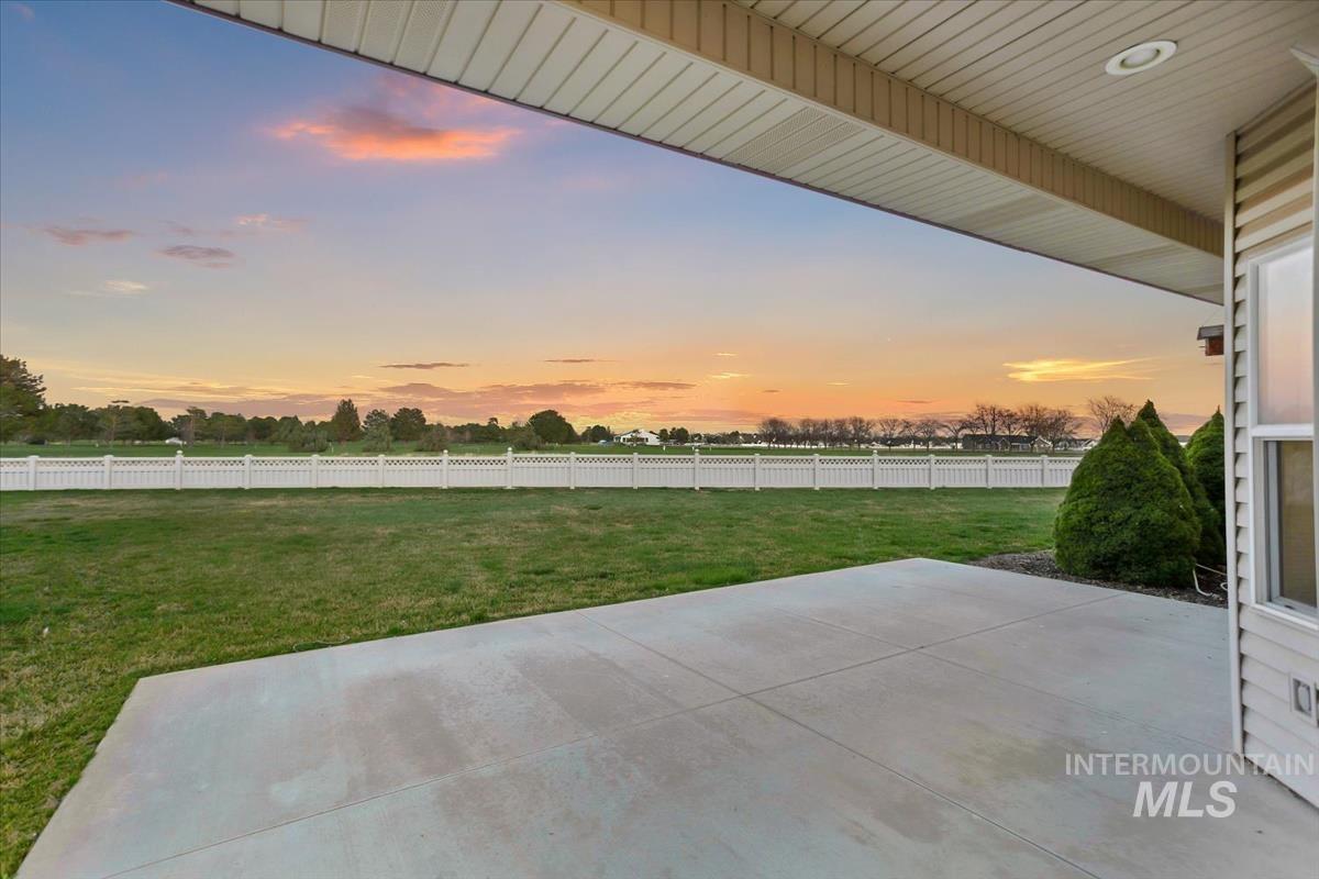 25074 The Driving Lane Caldwell, ID 83607 - Photo 22 of 29 Fenced backyard featuring a patio area