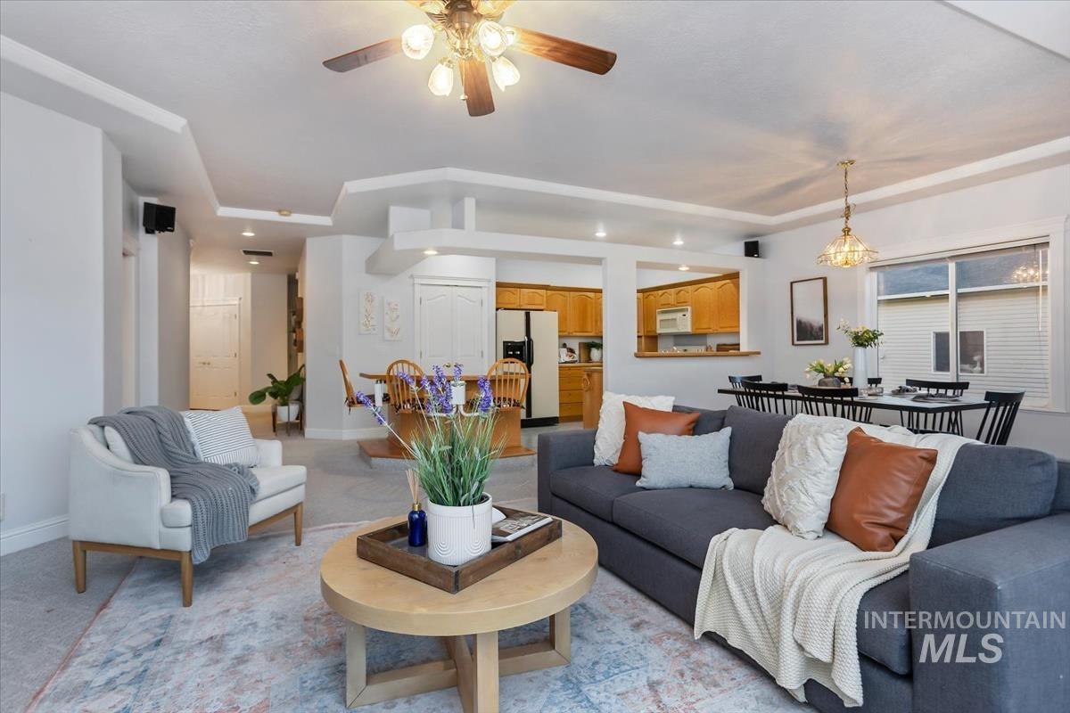 25074 The Driving Lane Caldwell, ID 83607 - Photo 7 of 29 Living area with a ceiling fan, light colored carpet, and recessed lighting