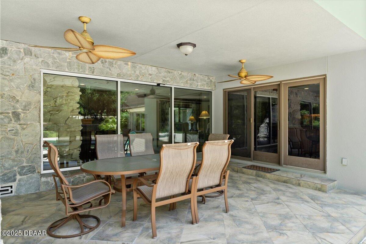 1010 Big Tree Road Daytona Beach, FL 32119 - Photo 11 of 41 a dining room with furniture and a window