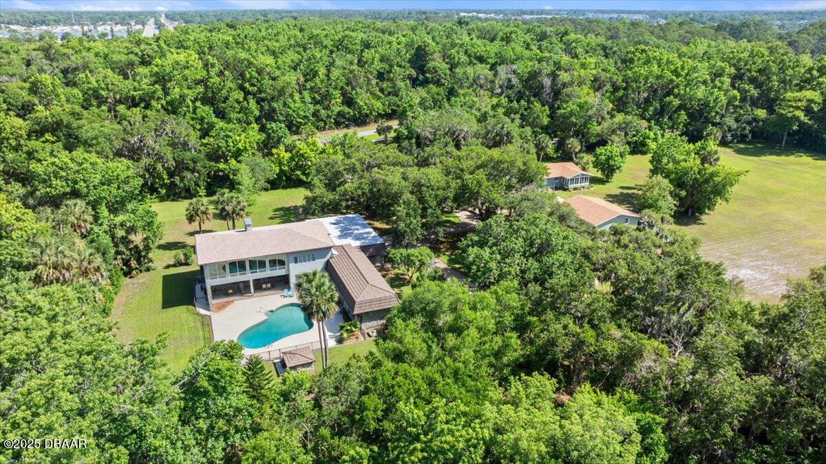 1010 Big Tree Road Daytona Beach, FL 32119 - Photo 20 of 41 an aerial view of a house with a yard basket ball court and outdoor seating