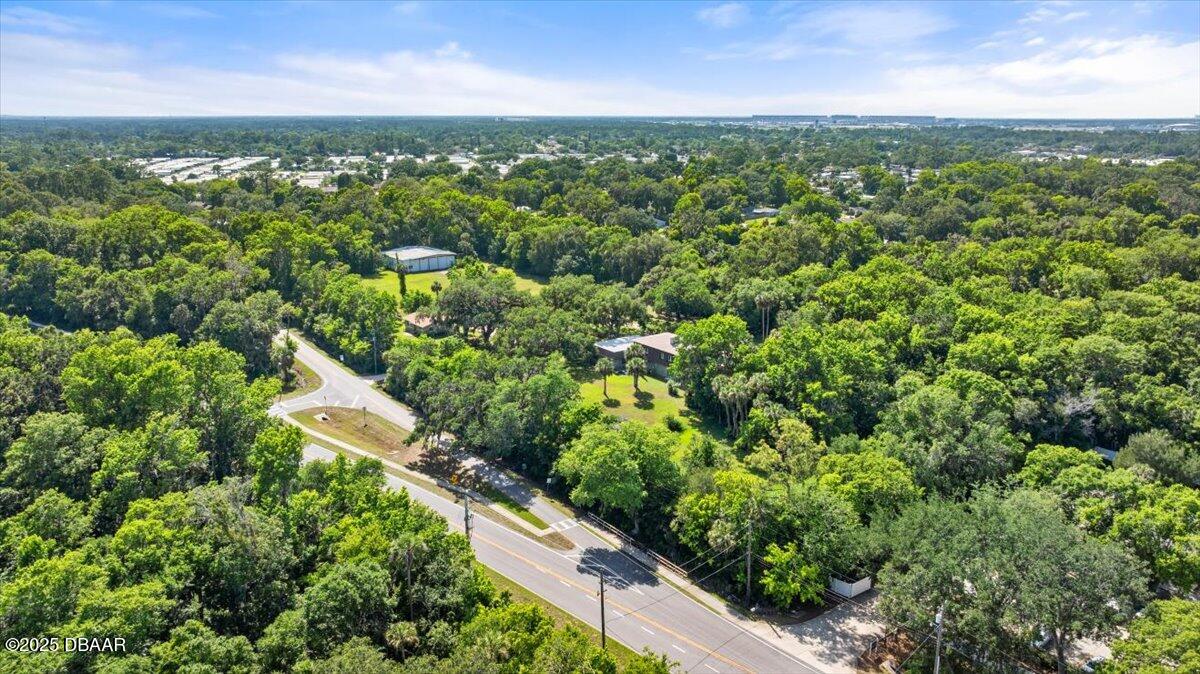 1010 Big Tree Road Daytona Beach, FL 32119 - Photo 22 of 41 an aerial view of residential houses with outdoor space and trees
