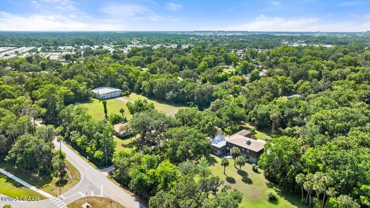 1010 Big Tree Road Daytona Beach, FL 32119 - Photo 24 of 41 an aerial view of residential houses with outdoor space and trees