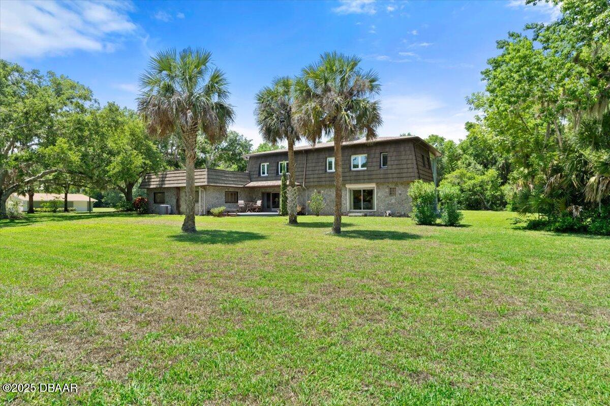 1010 Big Tree Road Daytona Beach, FL 32119 - Photo 27 of 41 a view of a house with a yard