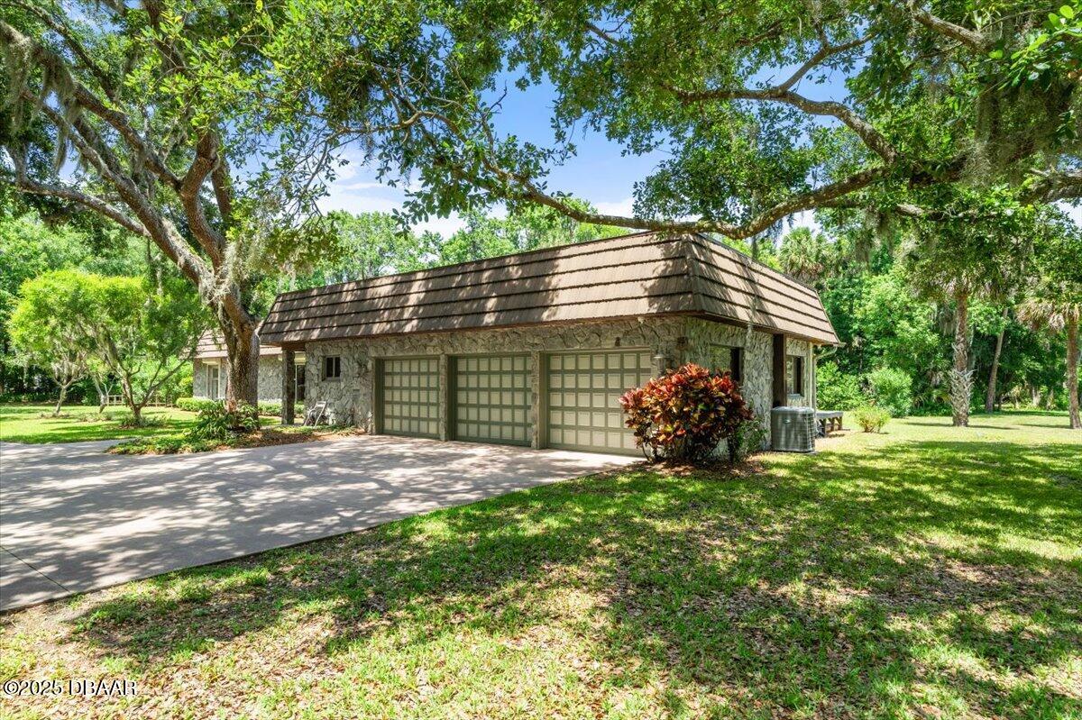 1010 Big Tree Road Daytona Beach, FL 32119 - Photo 34 of 41 a view of a house with a tree in a yard
