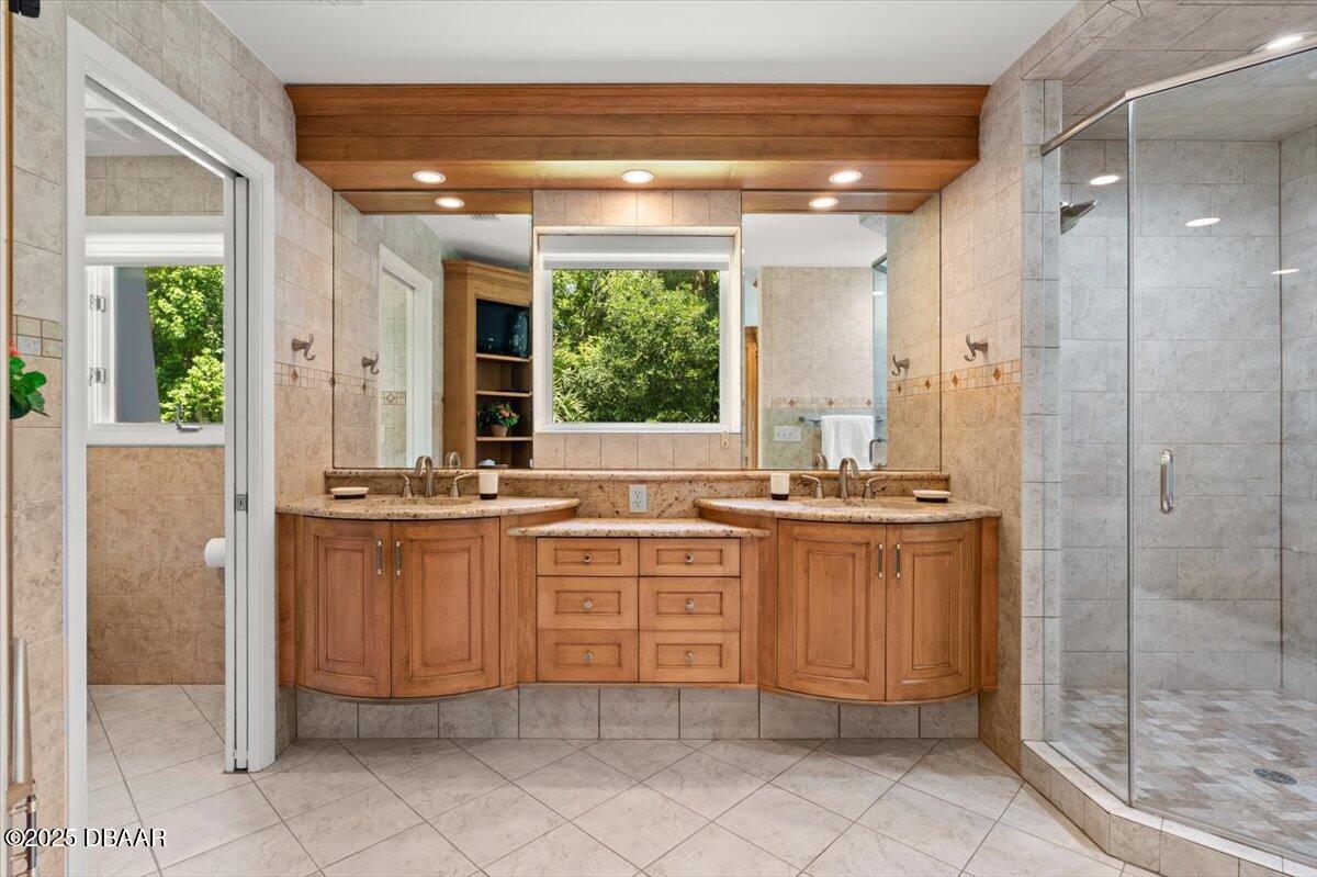 1010 Big Tree Road Daytona Beach, FL 32119 - Photo 9 of 41 a bathroom with a granite countertop sink and a mirror