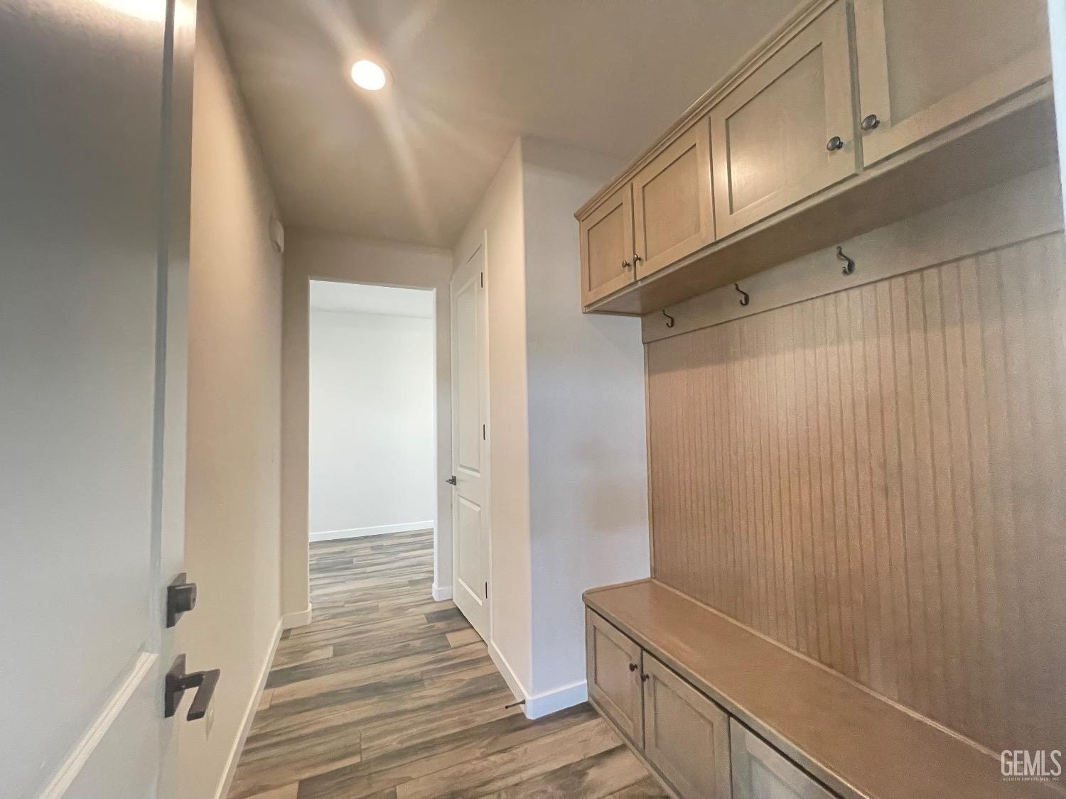 Undisclosed Address Bakersfield, CA 93314 - Photo 8 of 9 a view of a room with wooden floor and staircase