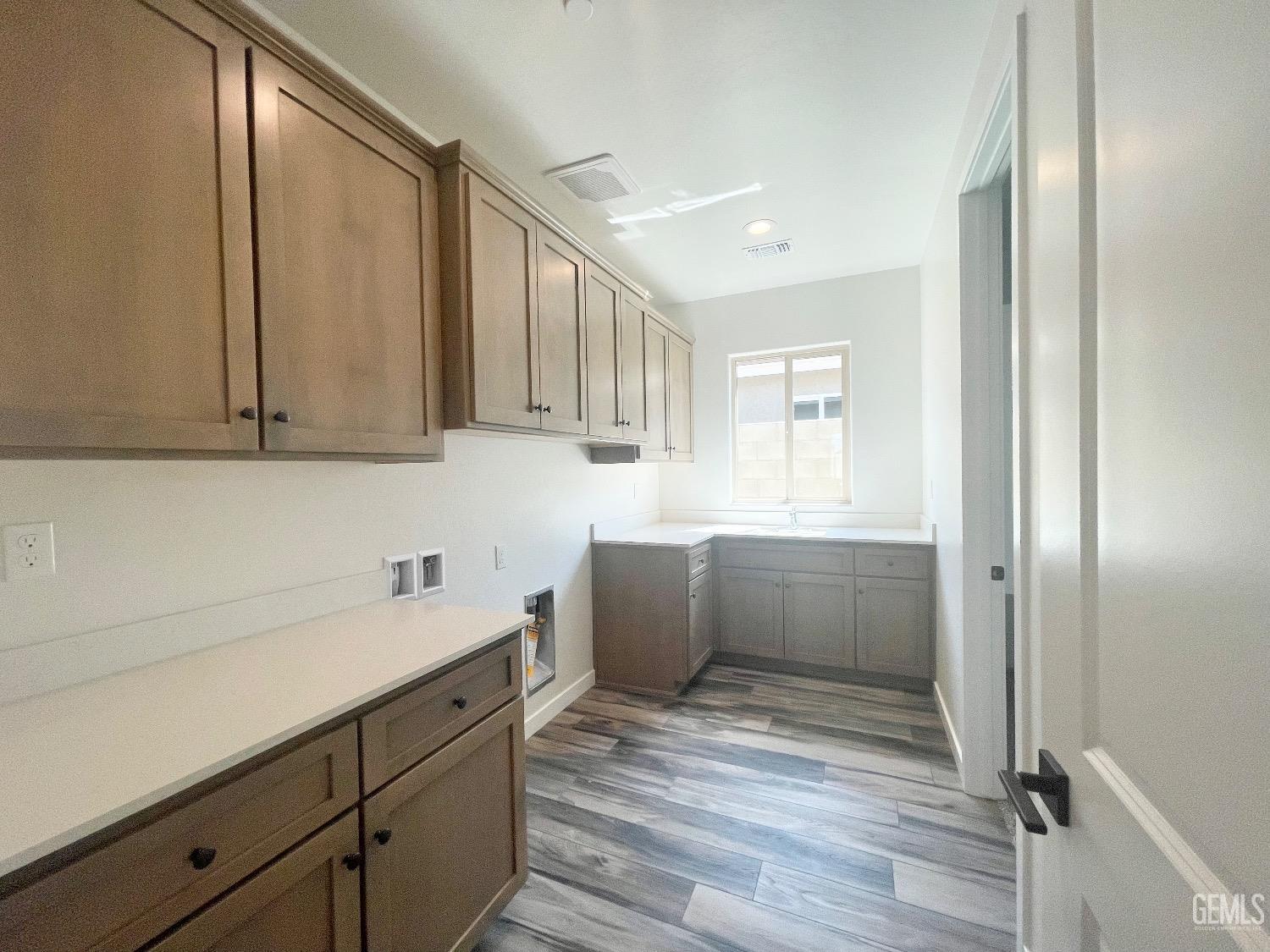 Undisclosed Address Bakersfield, CA 93314 - Photo 9 of 9 a kitchen with a refrigerator and sink