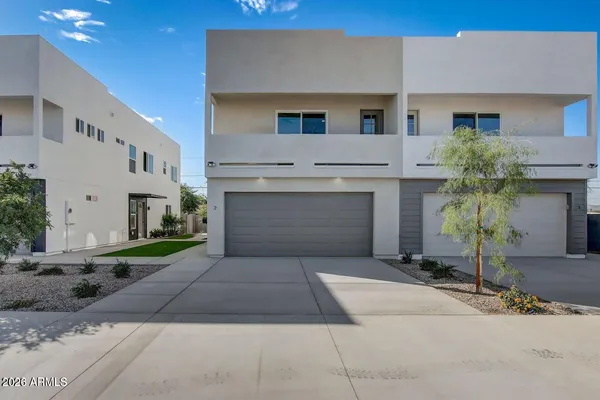 a front view of a house with yard