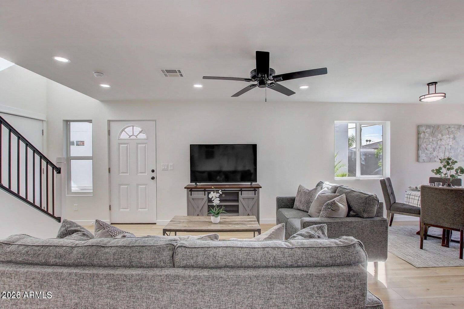 2509 East Broadway Road, Unit 2 Phoenix, AZ 85040 - Photo 20 of 47 a living room with furniture and a flat screen tv