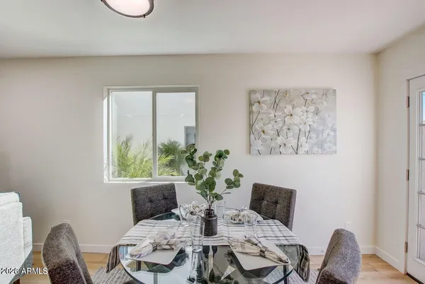 a view of a dining room with furniture and wooden floor