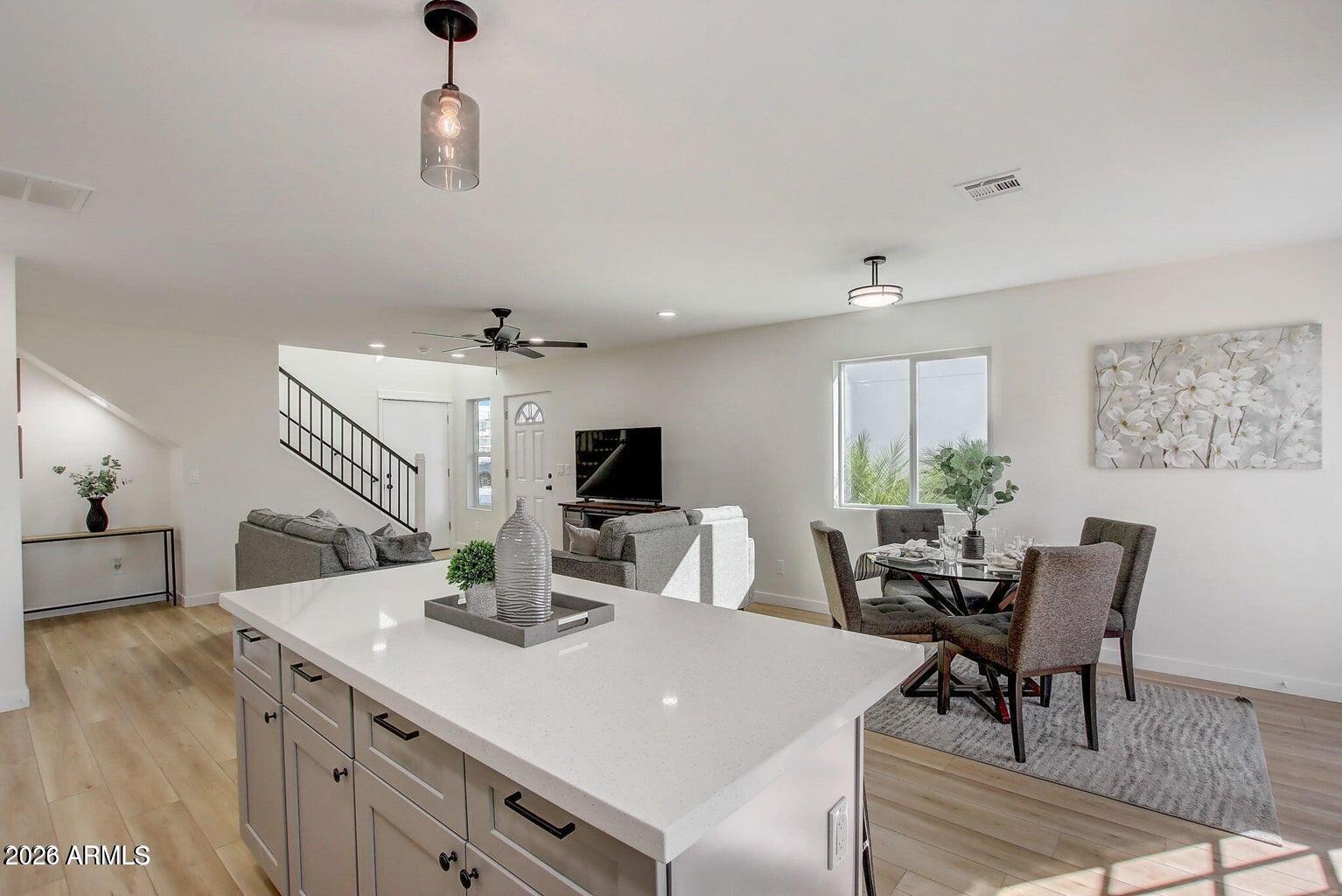 2509 East Broadway Road, Unit 2 Phoenix, AZ 85040 - Photo 23 of 47 a view of a dining room with furniture and wooden floor