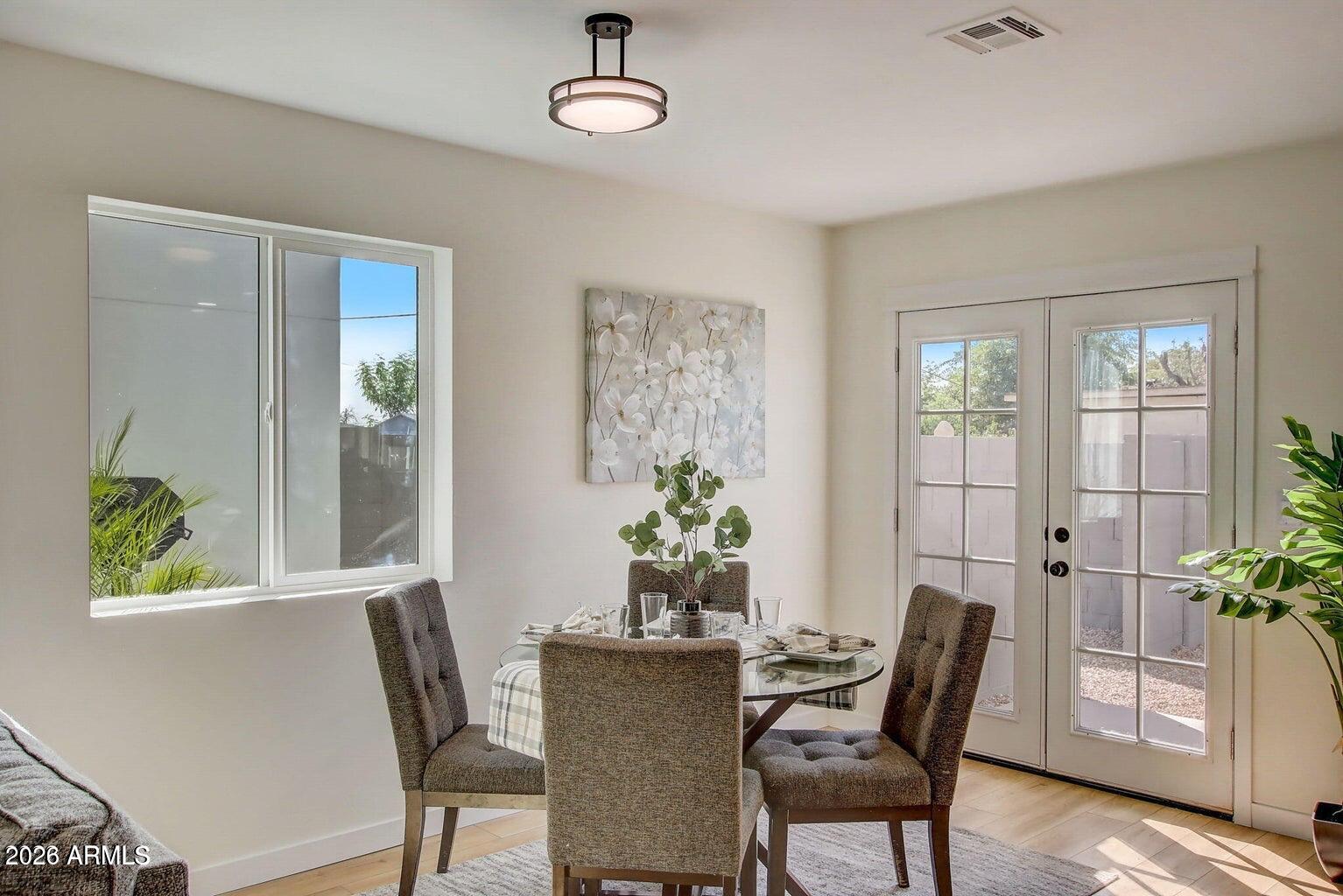 2509 East Broadway Road, Unit 2 Phoenix, AZ 85040 - Photo 3 of 47 a view of a dining room with furniture and window
