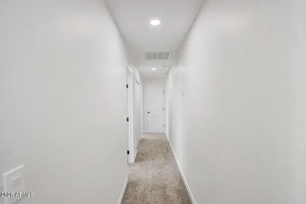 a view of a livingroom with a ceiling fan and window