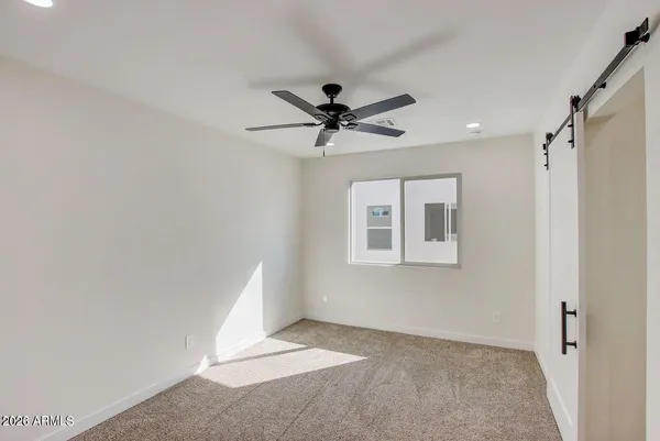a bathroom with a shower and a toilet