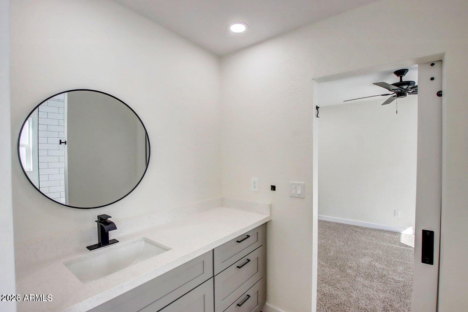 2509 East Broadway Road, Unit 2 Phoenix, AZ 85040 - Photo 34 of 47 a bathroom with a sink and a mirror