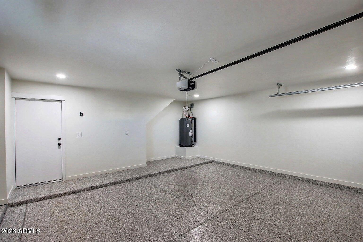 2509 East Broadway Road, Unit 2 Phoenix, AZ 85040 - Photo 37 of 47 an empty room with projector and windows