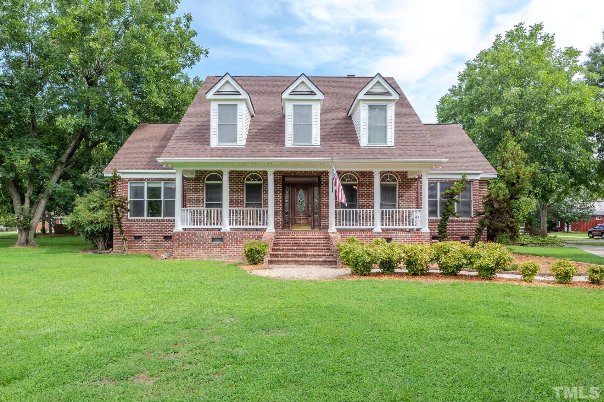 2213 East Garner Road Raleigh, NC 27610 - Photo 1 of 74 front view of a house with a yard