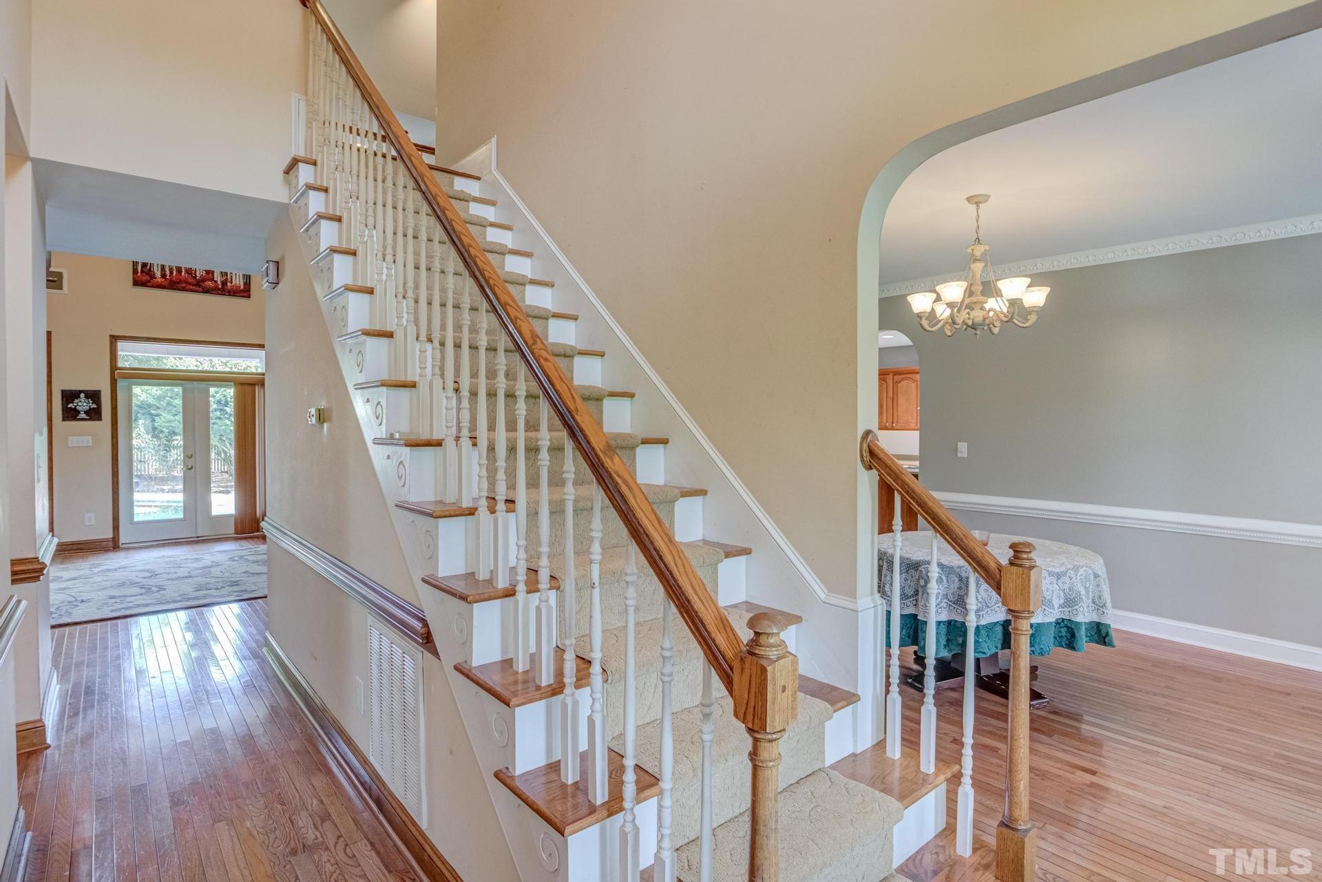 2213 East Garner Road Raleigh, NC 27610 - Photo 11 of 74 a view of entryway and hall with wooden floor